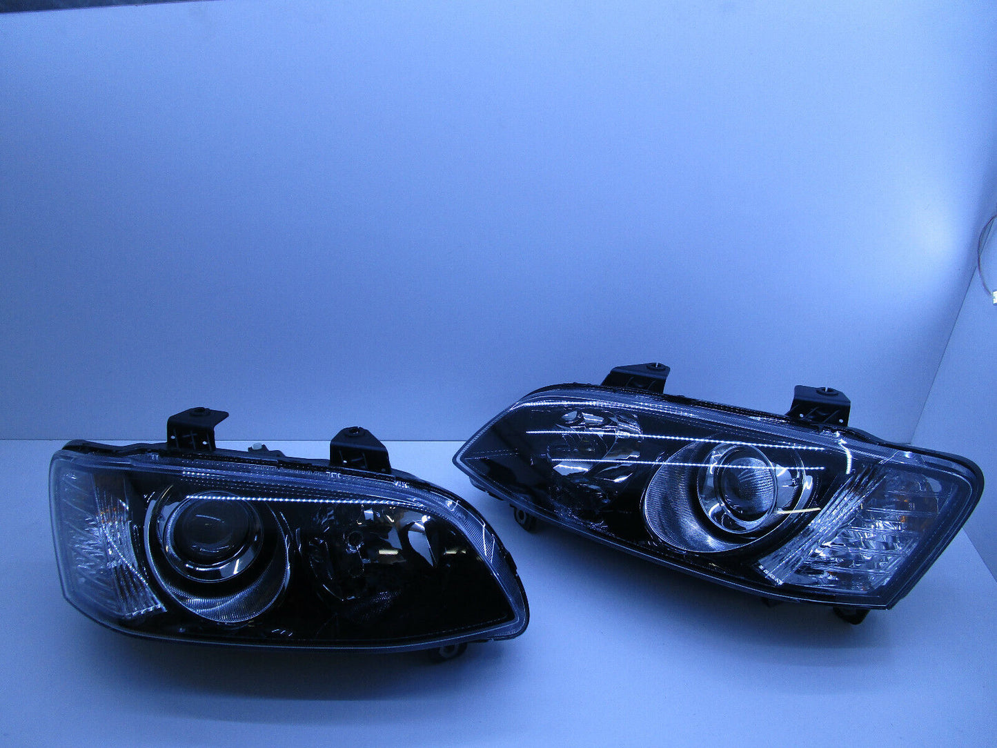 SSV CALAIS VE HEADLIGHTS PROJECTOR HOLDEN COMMODORE VE SERIES 2 GENUINE PAIR NEW