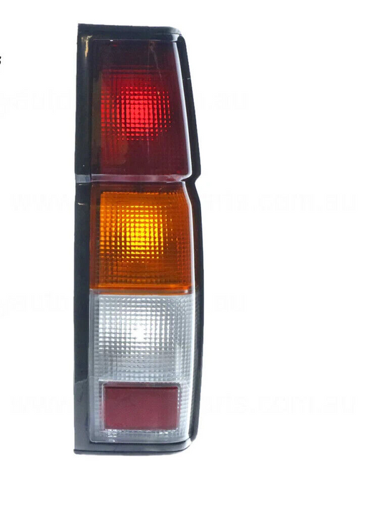 NEW RED/AMBER/CLEAR TAIL LAMP DRIVERS SIDE FOR NISSAN NAVARA 6/1992-3/1997