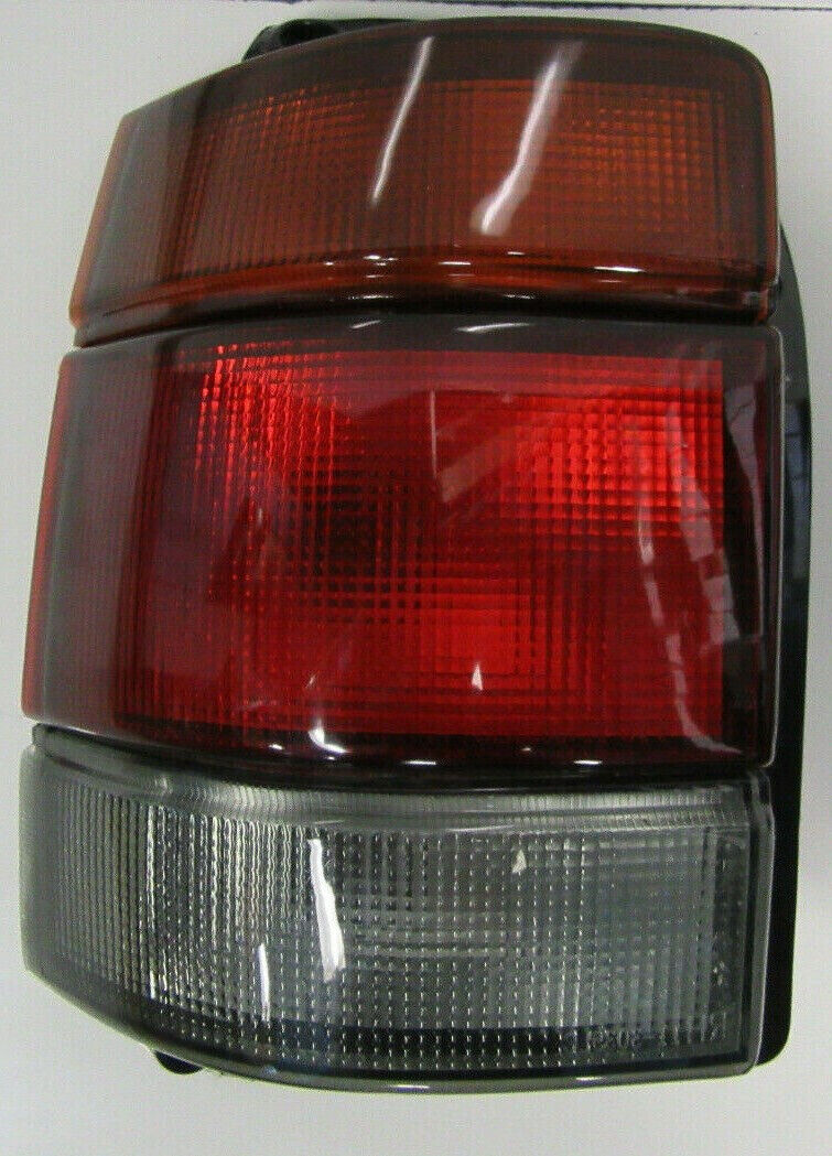 HOLDEN COMMODORE VR VS UTE WAGON SMOKEY/ TINTED TAIL LIGHT LEFT HAND SIDE NEW