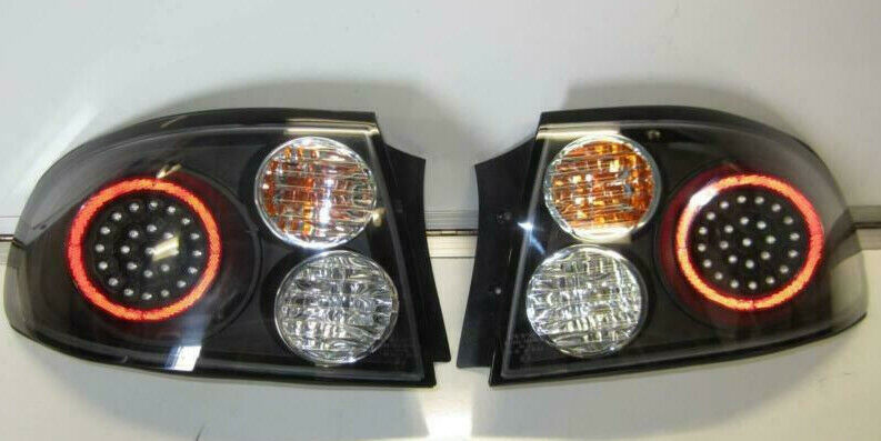 BLACK LED ALTEZZA TAIL LIGHTS PAIR NEW VT VX COMMODORE WITH GLOBES COMPLETE